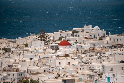 High angle view of townscape by sea