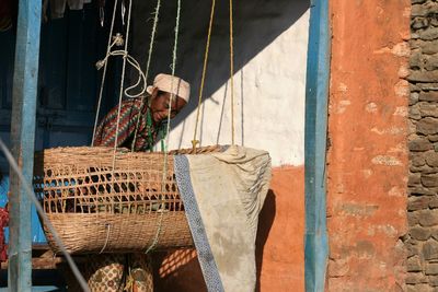 Smiling female worker working by swing