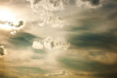 Low angle view of cloudy sky at sunset