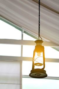 Close-up of illuminated lantern hanging from ceiling