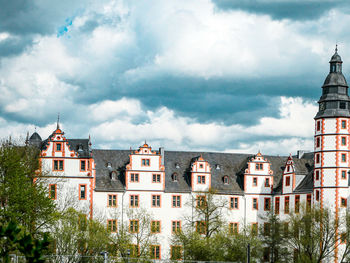 Panoramic view of buildings and trees against sky