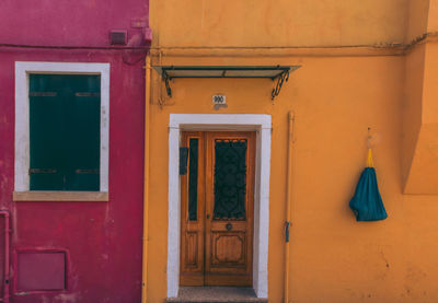 Closed door of yellow building