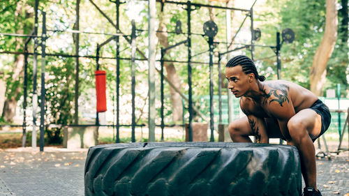 High angle view of man exercising on street in city