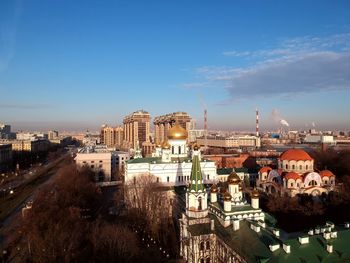 High angle view of buildings in city against sky