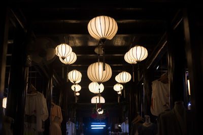 Low angle view of illuminated lanterns at market