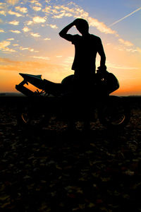 Silhouette of people at sunset