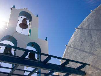 Low angle view of street light against building