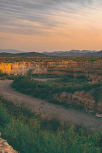 Scenic view of landscape against sky during sunset