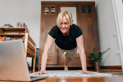 Woman exercising at home