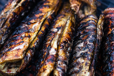 High angle view of fish on barbecue