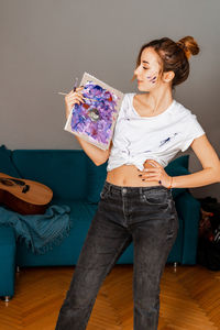 Young woman sitting at home