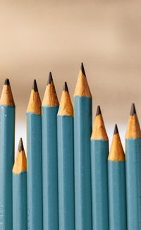 Close-up of pencils against wall