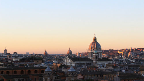 High angle view of buildings against sky at sunset