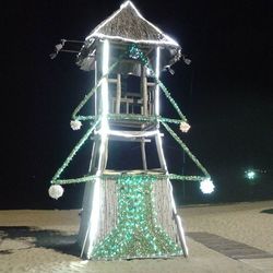 Low angle view of illuminated lights at night