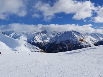 Scenic view of snowcapped mountains against sky
