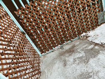 High angle view of wicker basket on building wall