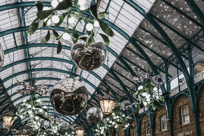 Low angle view of chandelier hanging from ceiling