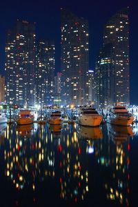 Illuminated city lit up at night