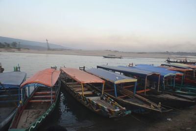 High angle view of boats moored in sea against sky