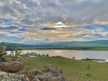 Scenic view of lake against sky during sunset