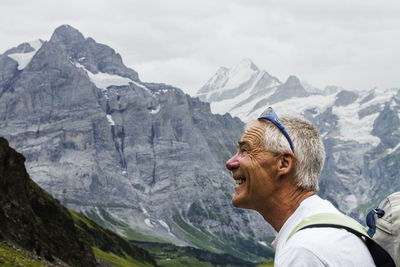 Smiling mature man hiking