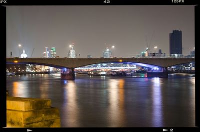 Bridge over river at night