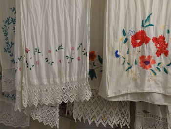 Close-up of white curtain hanging at home