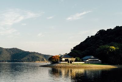 View of boats in lake against sky