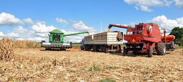 Panoramic shot of agricultural field against sky