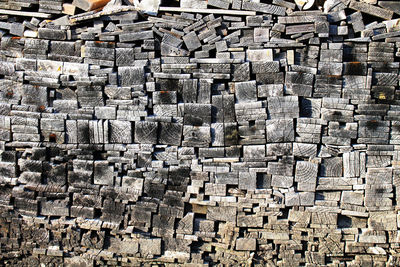 Full frame shot of firewood in forest