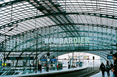 People waiting at railroad station platform