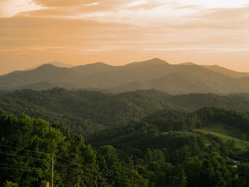 Scenic view of mountains against sky during sunset