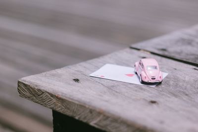 High angle view of toy car and card on table