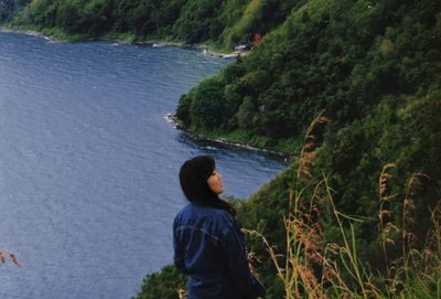 Rear view of man looking at sea