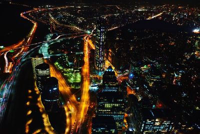 Aerial view of illuminated city at night