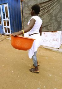 Rear view of girl standing on floor