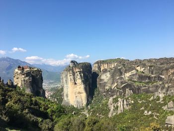 Scenic view of rock formations against sky