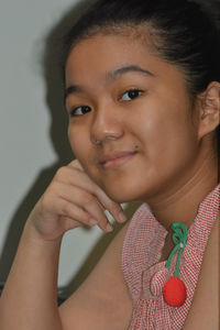 Close-up portrait of a smiling young woman