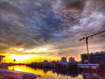 Scenic view of river against sky during sunset