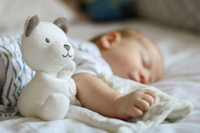 Cute baby sleeping on bed