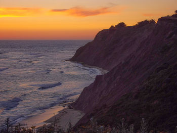 Scenic view of sea against dramatic sky