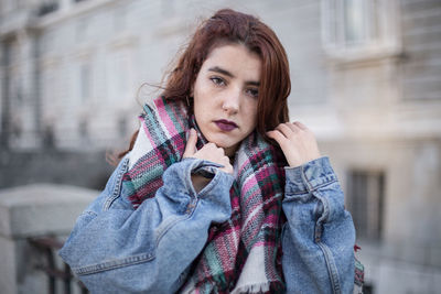 Portrait of young woman wearing warm clothing during winter