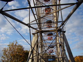 Low angle view of ferris wheel against sky