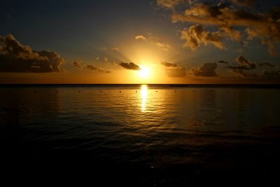 Scenic view of calm sea at sunset