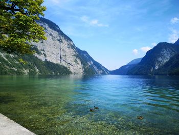 Scenic view of lake and mountains against sky