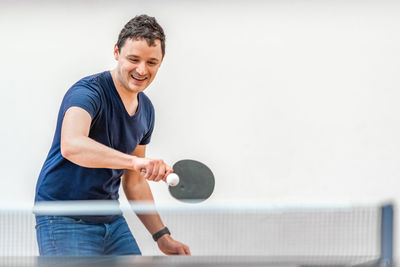 Portrait of man playing tennis