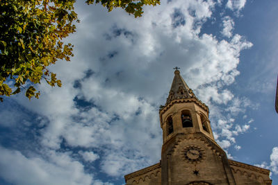 Low angle view of church and building against sky