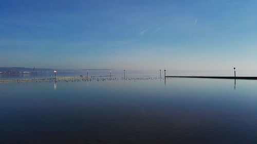 Scenic view of sea against blue sky