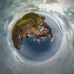 High angle view of sea and building against sky