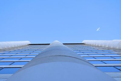 Low angle view of modern building against clear blue sky